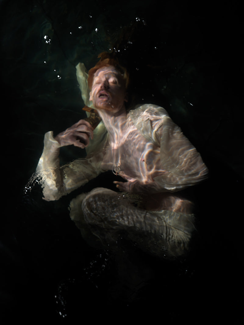 Underwater study held underwater with soft refraction and convey and dim light