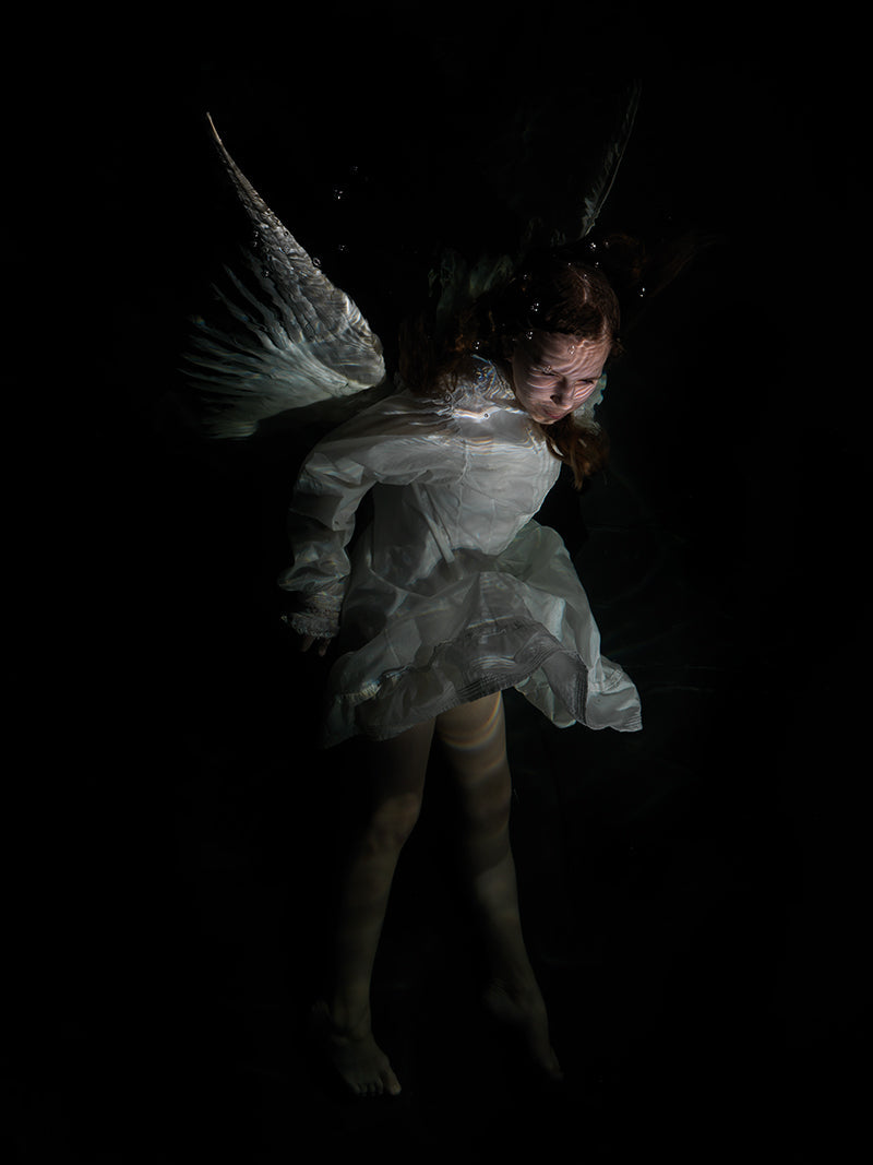 Underwater underwater study hovering with quiet eddies and silver light
