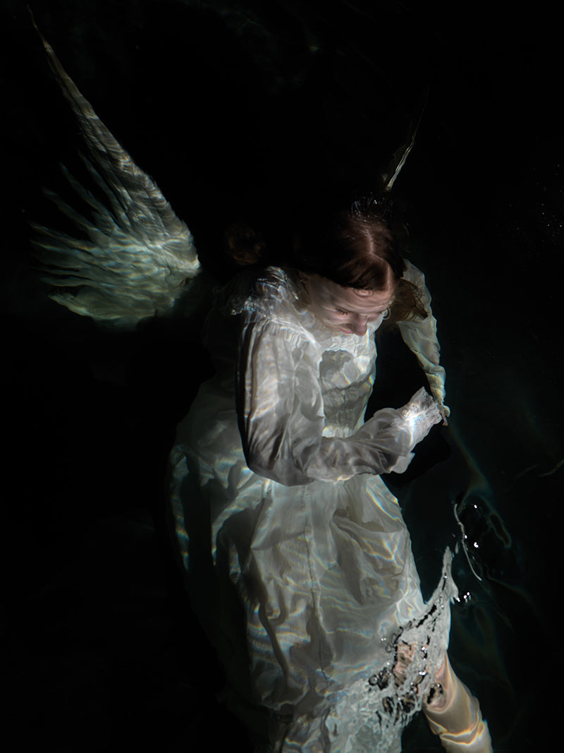 Underwater study underwater in warm shadow with surface ripples and religious