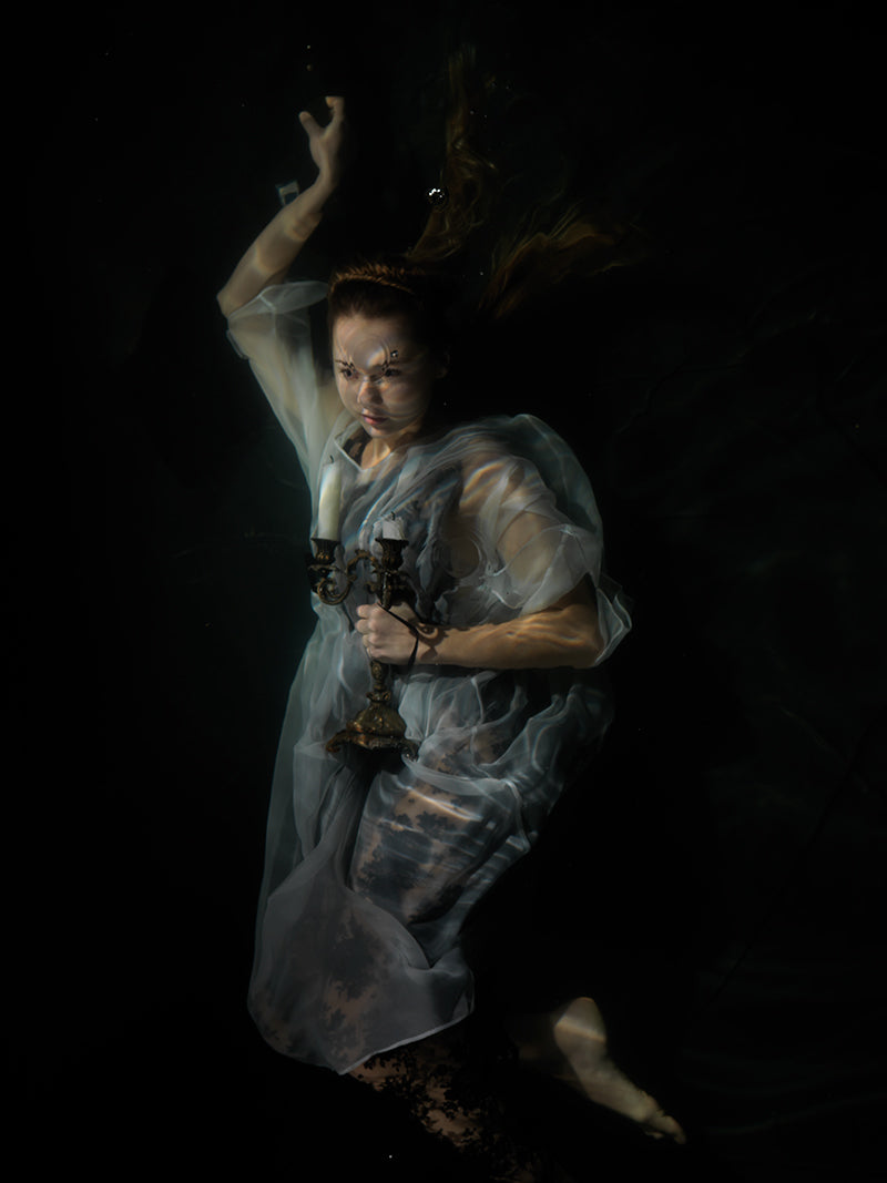 Underwater underwater still life drifting with quiet eddies and pale light