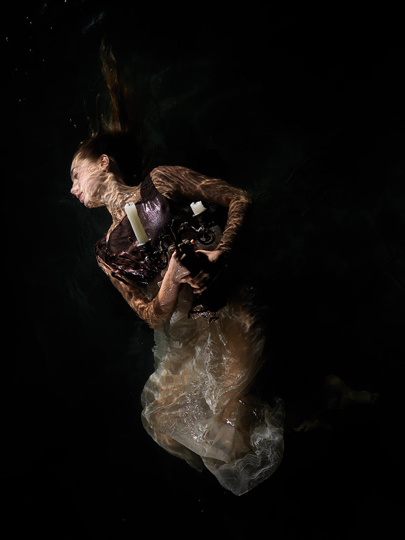 Underwater study drifting underwater with soft refraction and russian in warm shadow