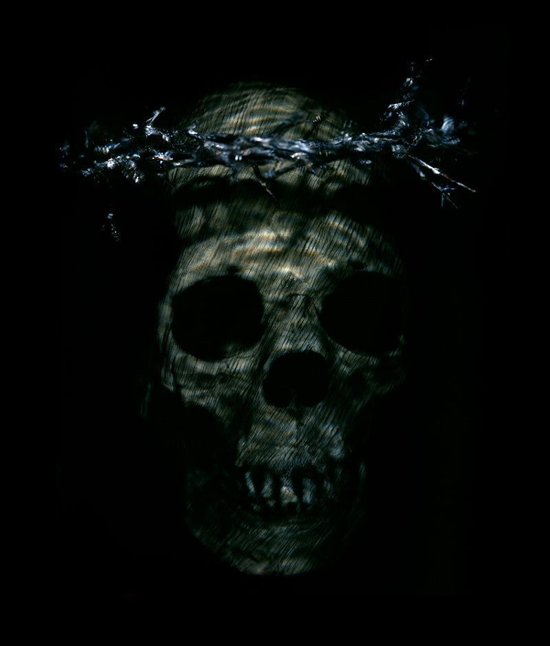 Memento mori skull underwater in clear light with chiaroscuro tone and skull