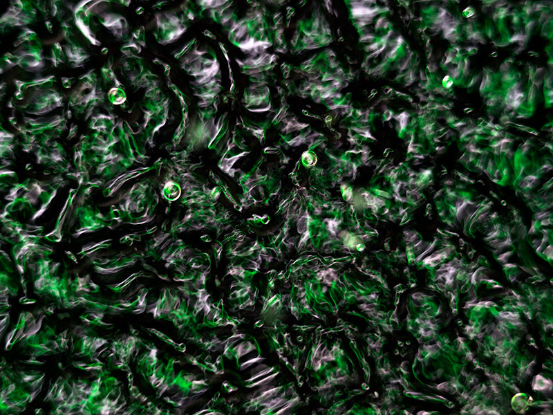 Water harmonics glimmering underwater with nodal lines in dim light