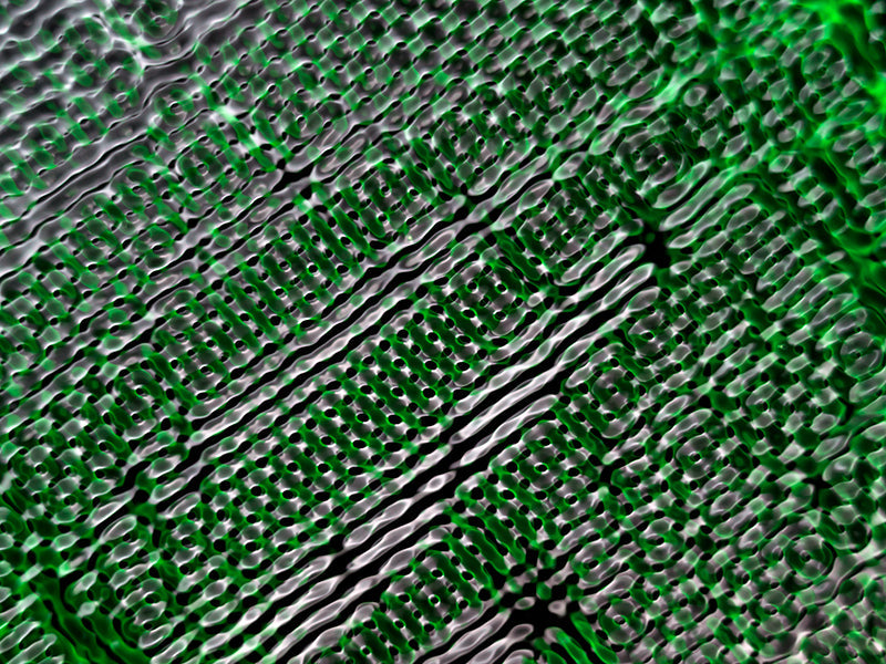 Water harmonics underwater in low light with concentric rings