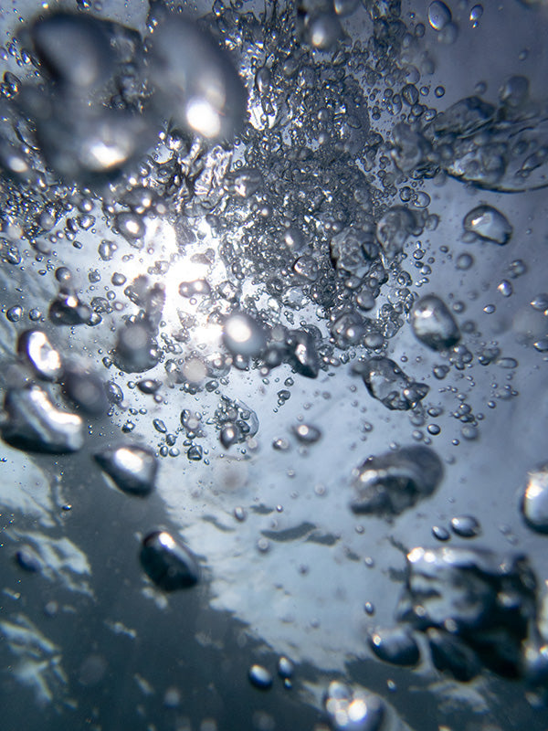 Underwater bubble field suspended with rising threads and science and soft light