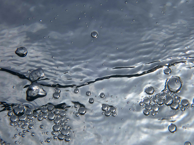Underwater bubble threads with silver beads and aquatic set in dim light