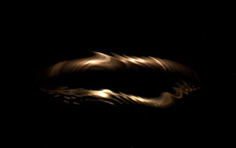Underwater still life glimmering underwater with soft refraction in cool shadow