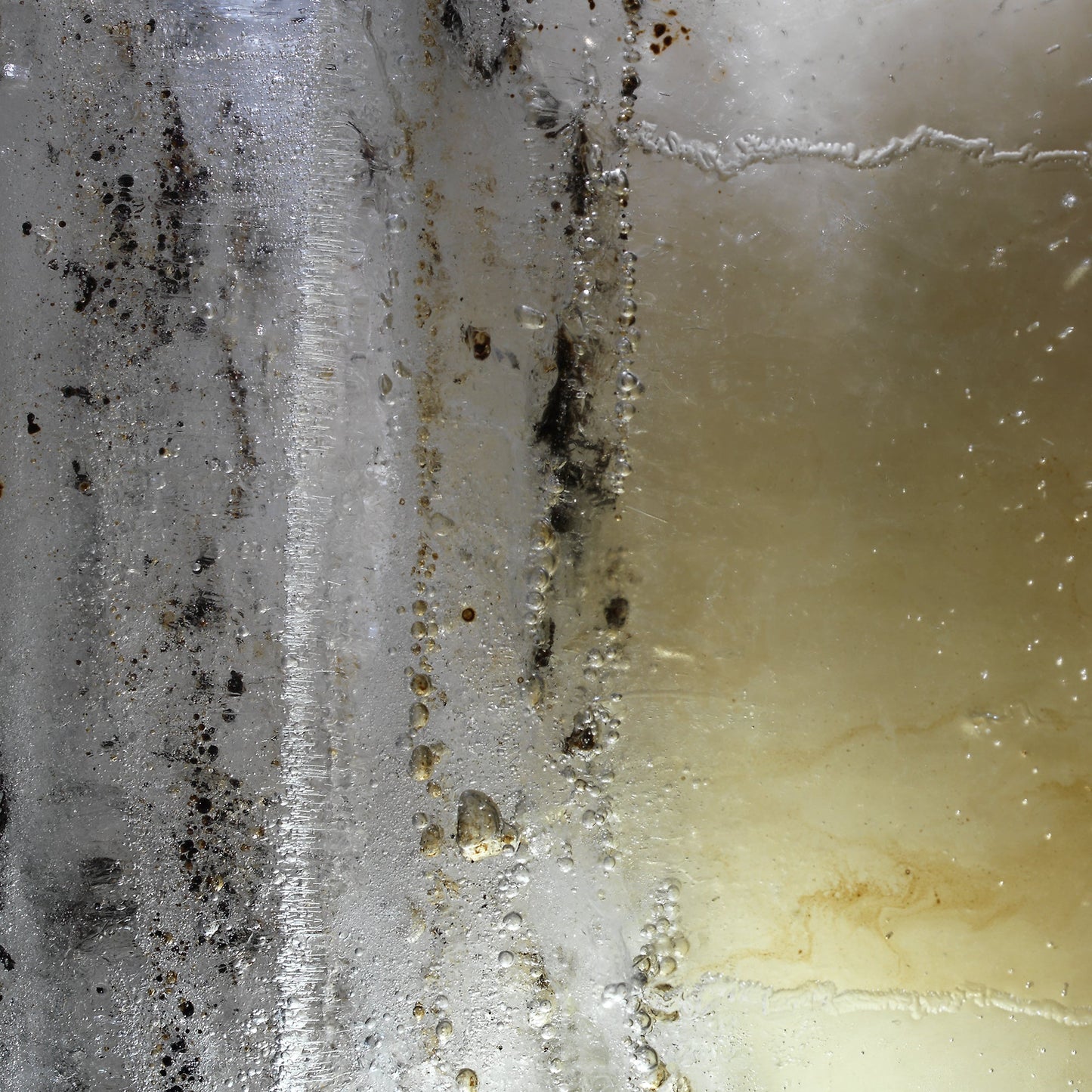 Oil film glimmering underwater with slick film in soft light