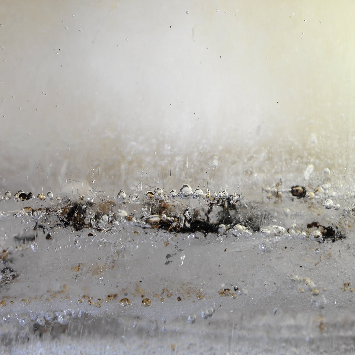 Oil film underwater in dim light with swirling film