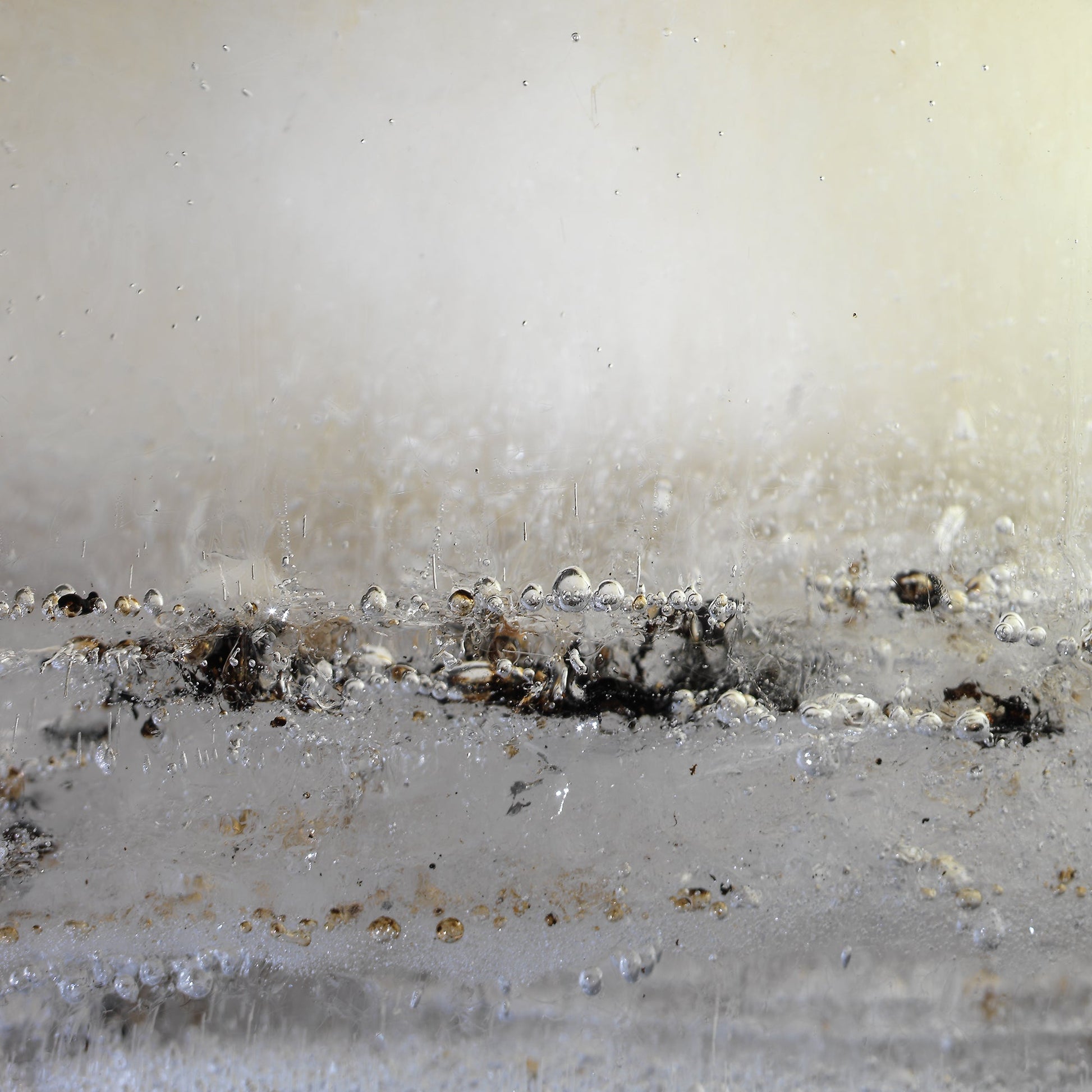 Oil film underwater in dim light with swirling film