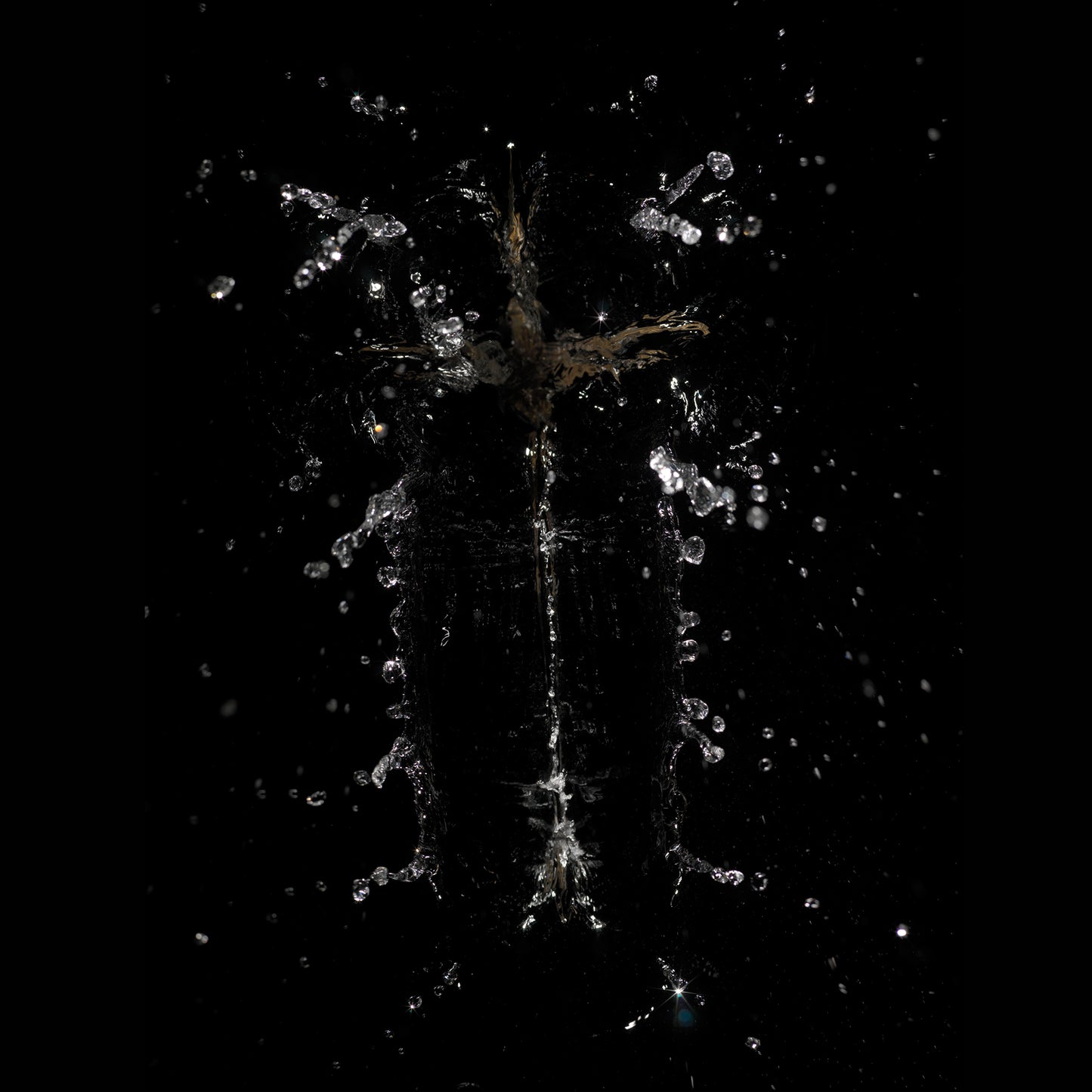 Splash figure suspended underwater with crown like splash in pale light