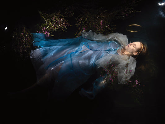 Underwater Ophelia with pure gold halo on analogue eight by ten film cool low light tonality
